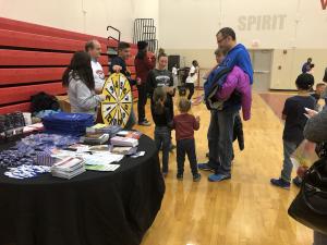 HEALTHIER TOGETHER's Executive Director Mark Peters helping our McKendree student volunteers engage attendees. 