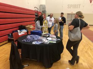 Executive Director, Mark Peters, and McKendree student volunteers educating families on various health & wellness topics. 