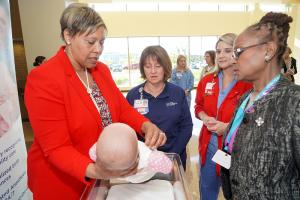 Paula Brody & Cynthia Price of SIHF Healthcare, and co-chairs of the Maternal and Child Health workgroup demonstrating the ABC's of Safe Sleep. 